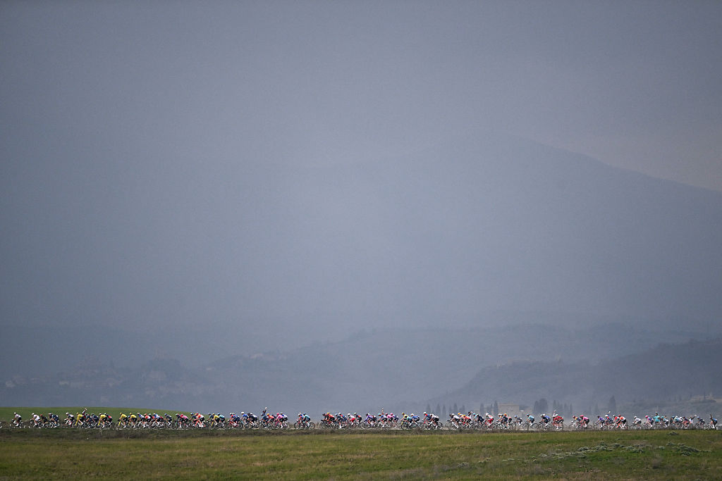 The pack rides during the 20th one-day classic 'Strade Bianche' (White Roads) men's cycling race between Siena and Siena in Tuscany on March 7, 2026. (Photo by Marco BERTORELLO / AFP)