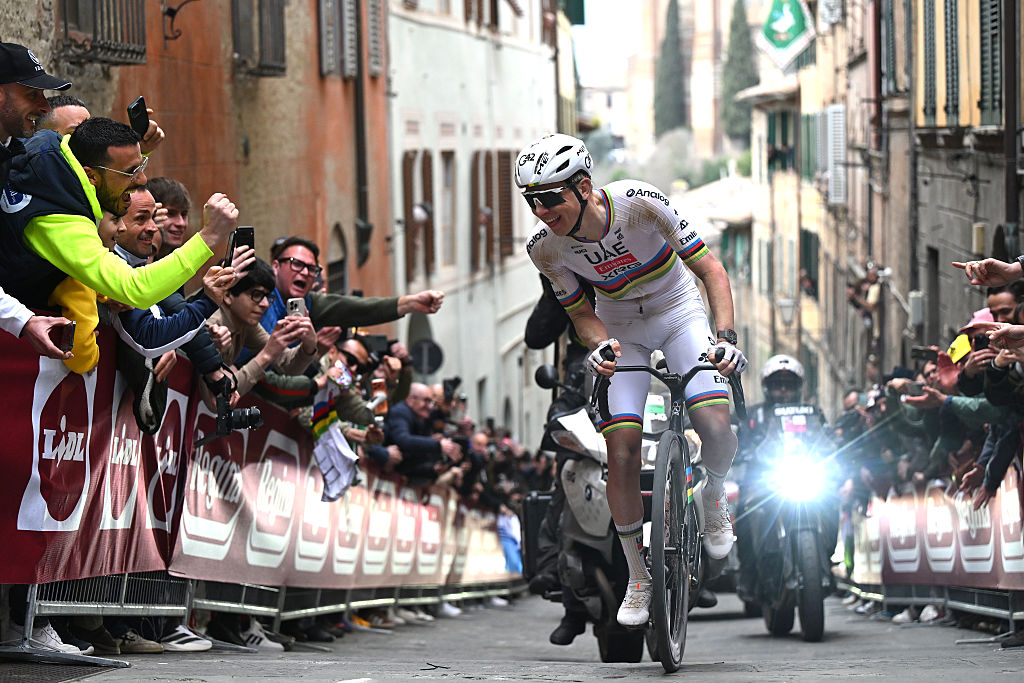 SIENA, ITALY - MARCH 07: Tadej Pogacar of Slovenia and UAE Team Emirates - XRG competes in the breakaway while fans cheers during the 20th Strade Bianche 2026 a 203km one day race from Siena to Siena / #UCIWT / on March 07, 2026 in Siena, Italy. (Photo by Luc Claessen/Getty Images)
