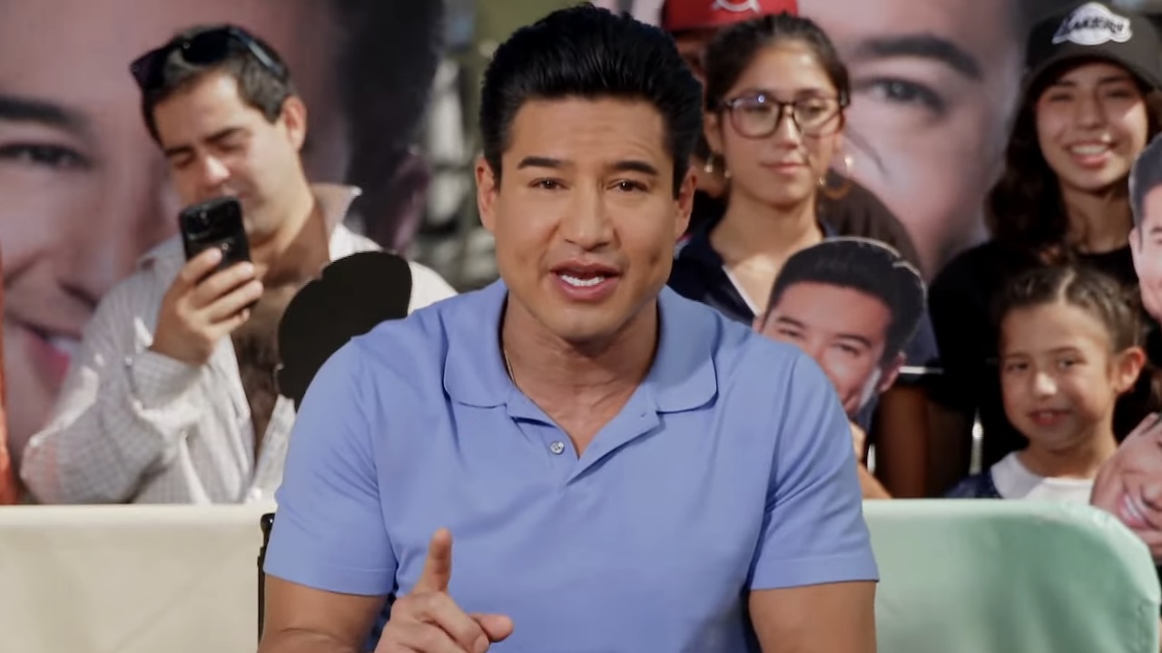 Mario Lopez in light blue polo hosting Mario Lopez Lookalike contest on Access Hollywood
