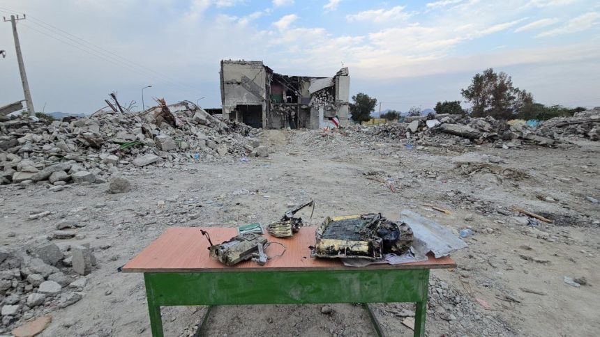 Munition fragments are displayed on a table near the shell of the Shajareh Tayyiba elementary school in Minab, southern Iran, where state media say at least 168 children and 14 teachers were killed in a strike on February 28.