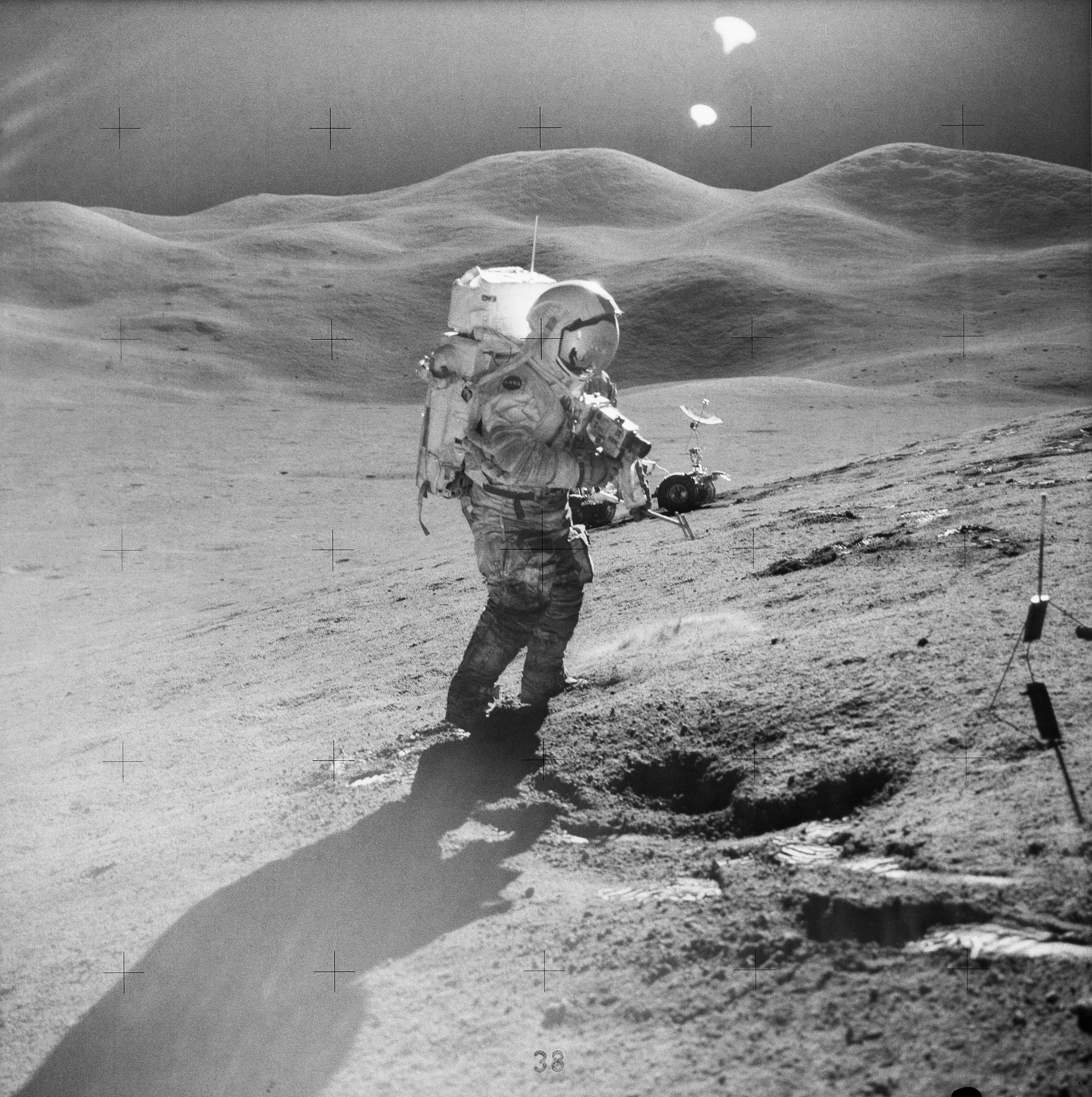 A photo of astronaut David R. Scott filming on the lunar surface as part of the Apollo 15 mission in 1971.