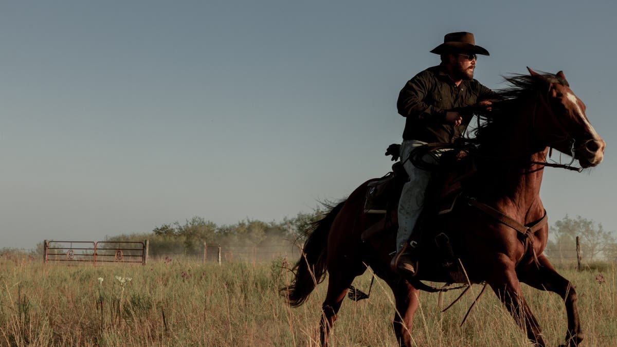 Cole Hauser riding a horse