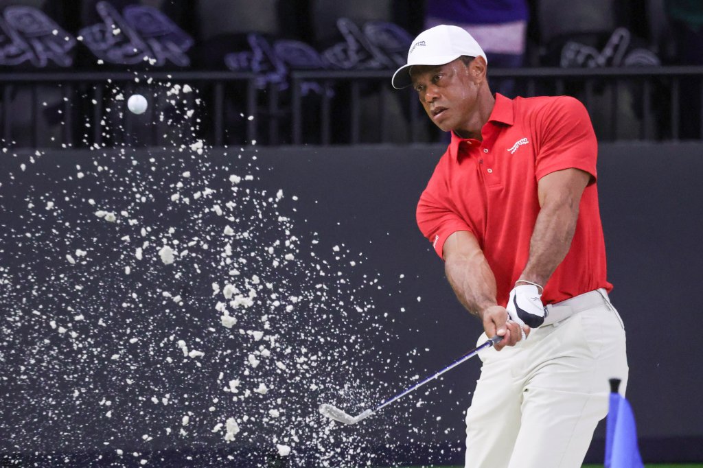 Tiger Woods hits a practice shot from a bunker before the TGL finals golf tournament in Palm Beach Gardens, Fla., Tuesday, March 24, 2026.