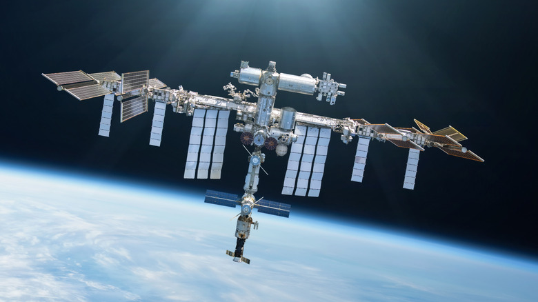 International Space Station orbiting above Earth. Outer space laboratory. Elements of this image furnished by nasa.