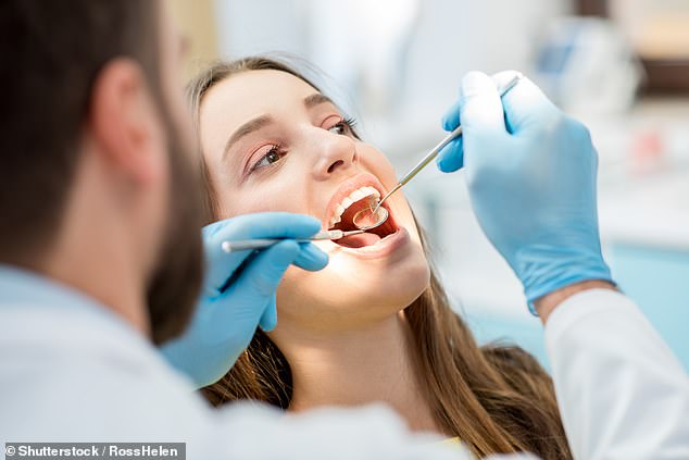 Bleeding or puffy gums can be a sign of inflammation associated with diabetes or heart disease (stock image)