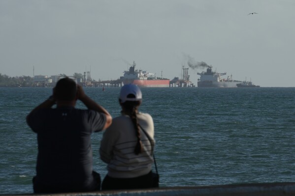 Russian-flagged oil tanker Anatoly Kolodkin, right, docks at an oil terminal in Matanzas, Cuba, Tuesday, March 31, 2026. (AP Photo/Ramon Espinosa)