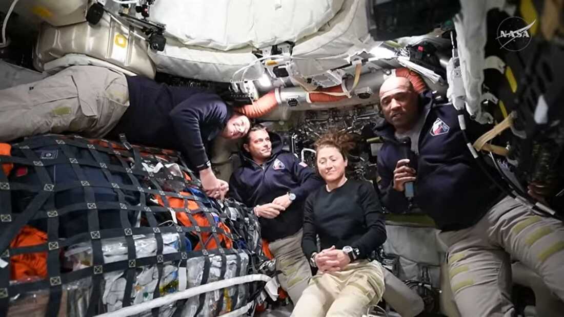 The four members of NASA's Artemis II crew (from left to right), Jeremy Hansen, Reid Wiseman, Christina Koch and Victor Glover, answer questions from the media during a news conference as they journey to the moon.