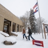 Voters walk into the Oak Creek Town Hall to drop off their ballots on Nov. 5, 2024, in Oak Creek, Colo.