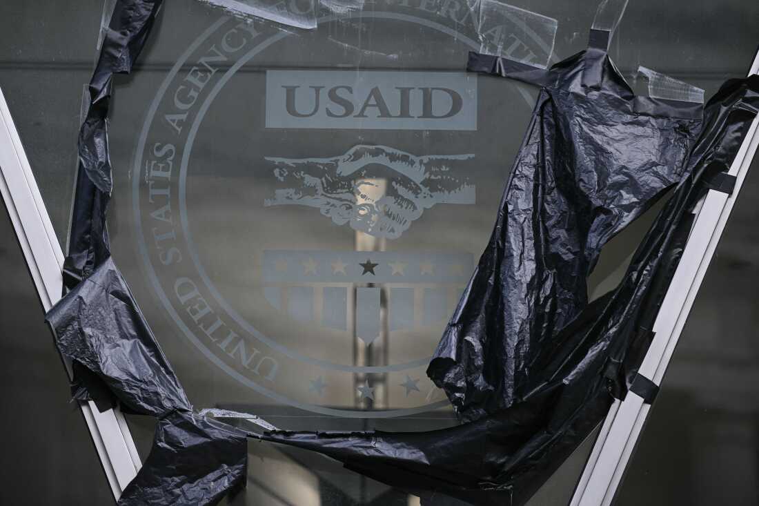 Remnants of signage for the US Agency for International Development (USAID) on the facade of the Ronald Reagan Building and International Trade Center building in Washington, D.C., on December 29, 2025.