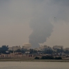 A plume of smoke rises after a reported Iranian strike on fuel tanks in Muharraq, Bahrain, on March 12.