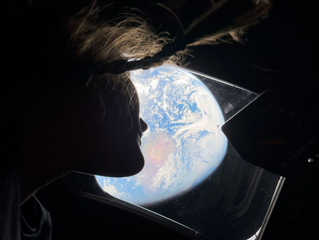 NASA astronaut Christina Koch looks back on Earth.