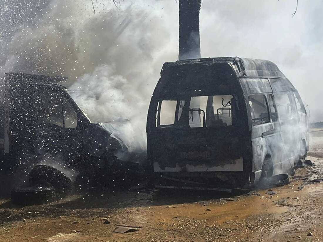 A truck and ambulance burn after Israeli airstrikes hit a group of paramedics outside a hospital in Marjayoun, southern Lebanon, on Oct. 4, 2024.
