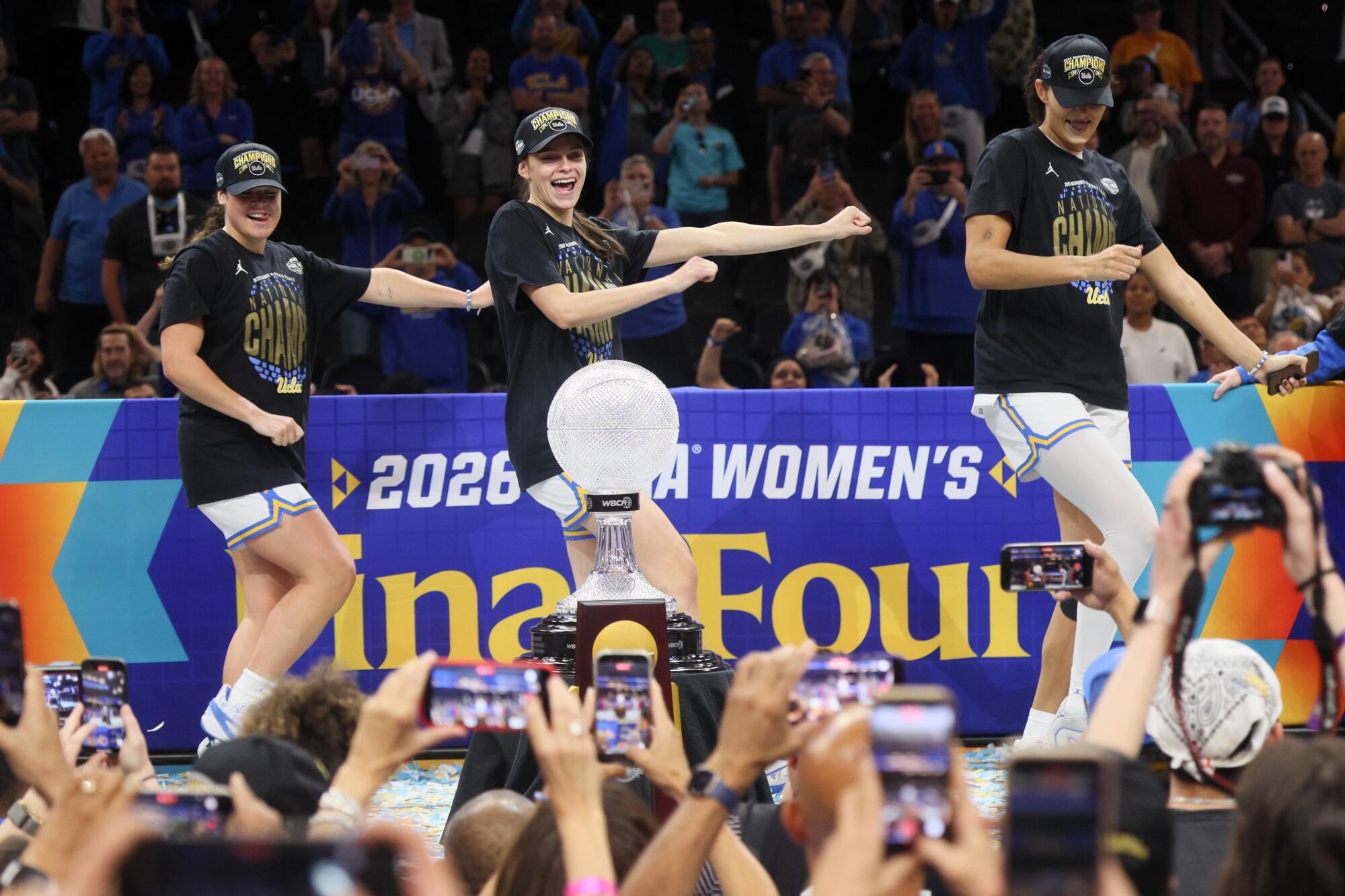 UCLA's (from left) Charlisse Leger-Walker, Gabriela Jaquez and Lauren Betts dance on stage.