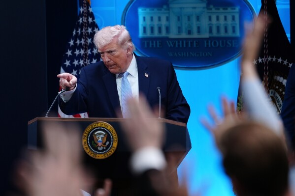 President Donald Trump gestures while speaking with reporters in the James Brady Press Briefing Room at the White House, Monday, April 6, 2026, in Washington. (AP Photo/Julia Demaree Nikhinson)