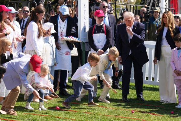 President Donald Trump and first lady Melania Trump participate in the White House Easter Egg Roll on the South Lawn of the White House, Monday, April 6, 2026, in Washington. (AP Photo/Mark Schiefelbein)