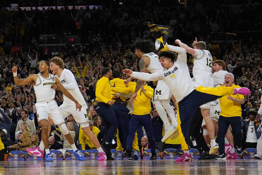 Members of Michigan celebrate after defeating UConn in the NCAA college basketball tournament national championship game at the Final Four, Monday, April 6, 2026, in Indianapolis.