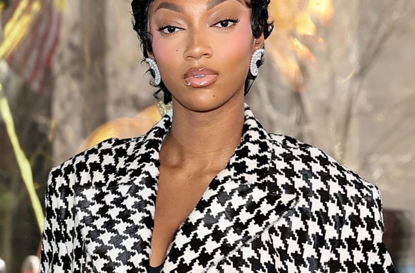  Angel Reese Enters Her Atlanta Dream Era in a Black-and-White Houndstooth Skirt Set