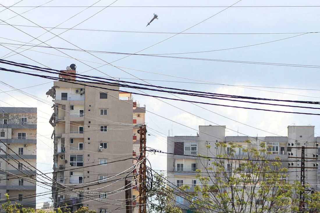 A projectile is seen moments before hitting a building during an Israeli airstrike in the area of Abbasiyeh, on the outskirts of the southern Lebanese city of Tyre, on April 8, 2026.