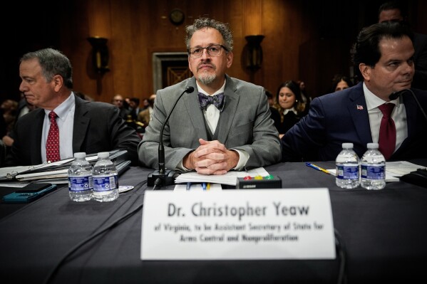 Christopher Yeaw, center, arrives to a Senate Foreign Relations Committee confirmation hearing on his nomination to be an assistant Secretary of State, Nov. 19, 2025, on Capitol Hill in Washington. (AP Photo/Julia Demaree Nikhinson, File)