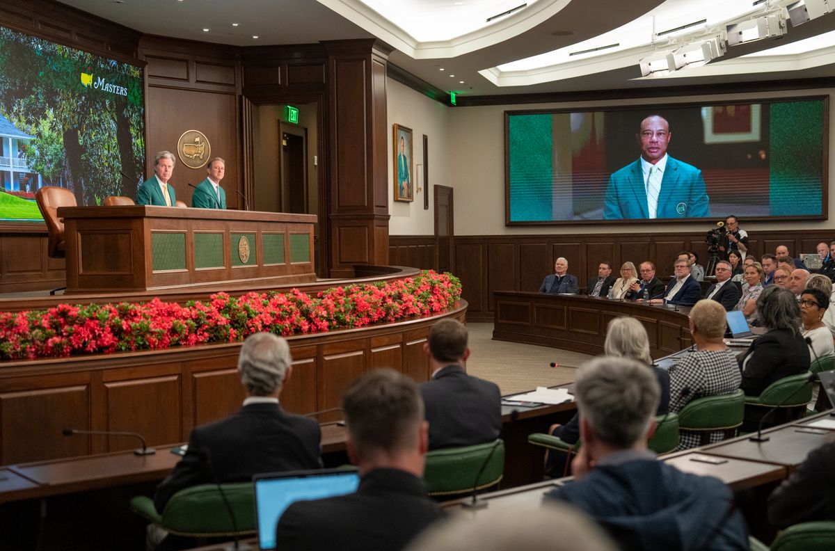 Tiger Woods speaks via a video as Chairman of Augusta National Golf Club and the Masters Tournament Fred S. Ridley speaks to the media