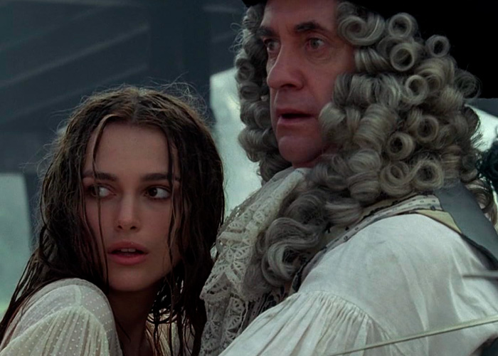 Brian C*x in period costume facing backlash after brutal dig at Margot Robbie and Daniel Day-Lewis in film scene.