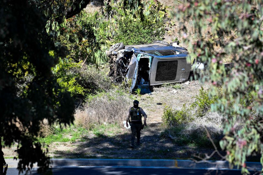 Woods' damaged vehicle is seen on its side after the rollover accident in Rancho Palos Verdes, California, on February 23, 2021.