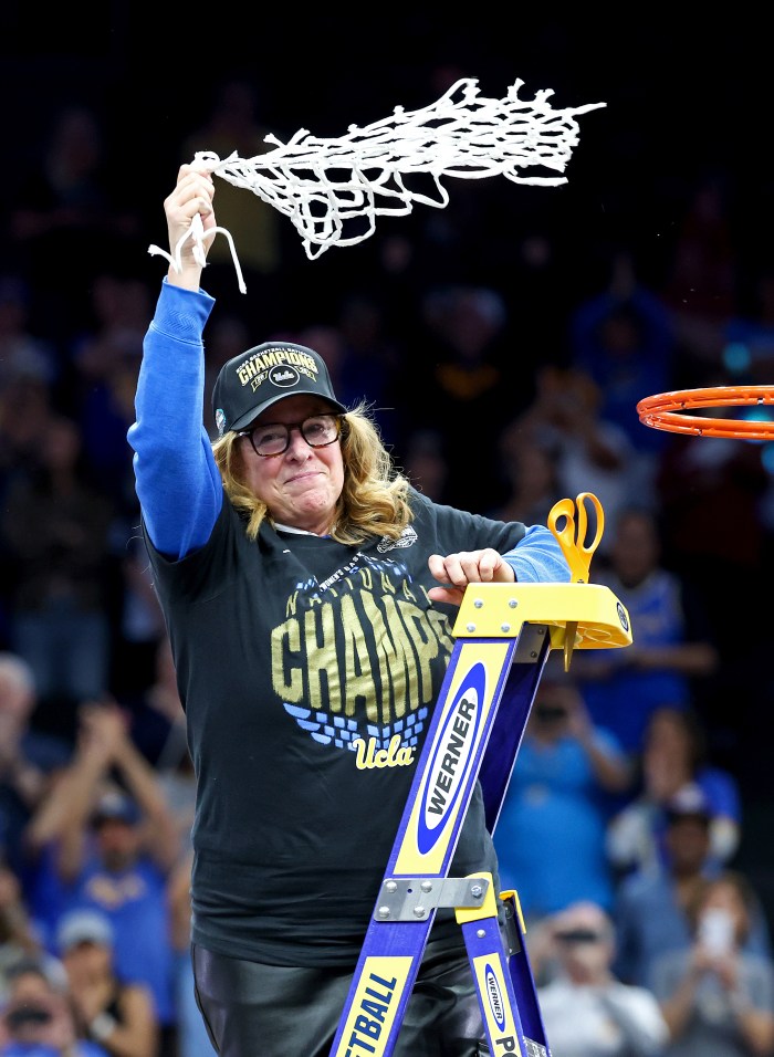 Cori Close celebrates after cutting the net down