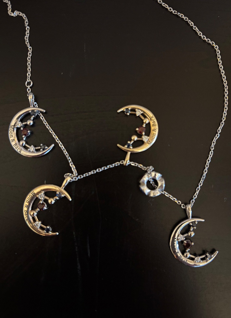Jeremy Hansen's pendant with his family’s birth stones inset and engraved with the words “moon and back”.