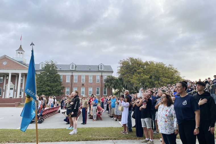 Families saluted and honored the American flag as a Marine sang the American anthem.