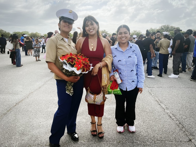 U.S. Marines graduate Pvt. Ramirez Garcia, her wife and her sister, right, Emily Ramirez pose after the graduation.