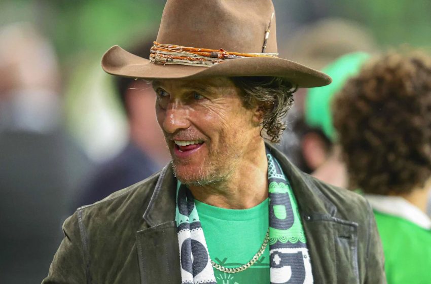  Matthew McConaughey Is Totally Unrecognizable With Fluffy Blonde Pigtails and Pale Pink Feather Robe