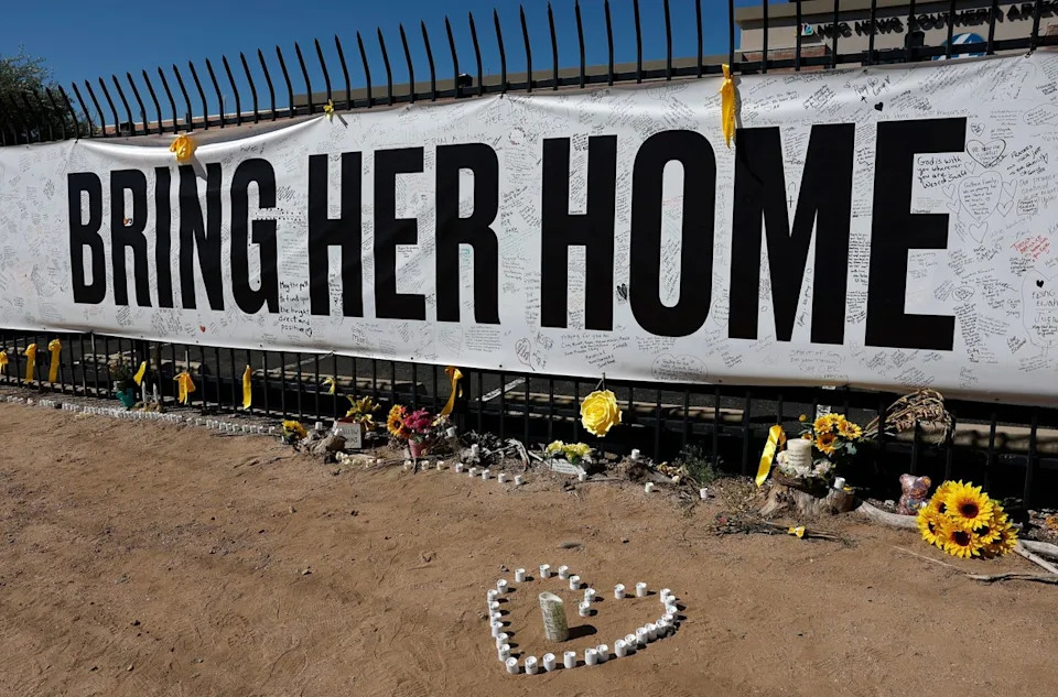 A memorial with yellow details honoring Nancy Guthrie in Tucson, Arizona (Getty Images)