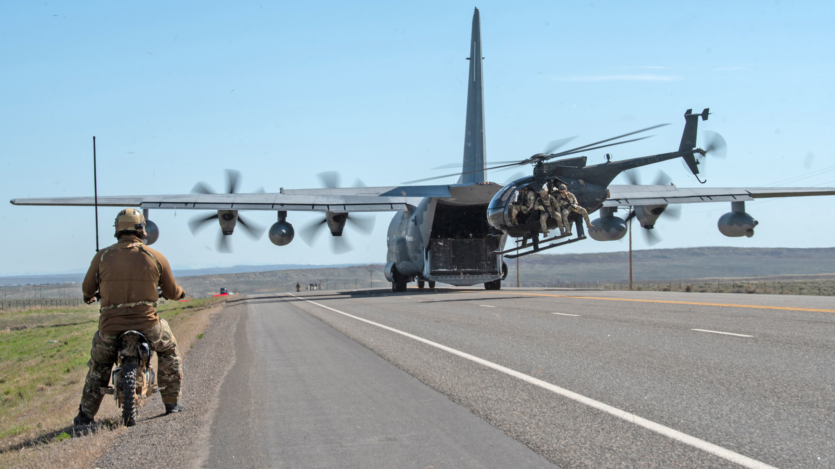 Airmen from the Kentucky Air National Guard’s 123rd Special Tactics Squadron prepare to conduct combat search-and-rescue from an MH-6M Little Bird that was offloaded from a MC-130J Commando II during Exercise Agile Chariot near Riverton, Wyoming, May 2, 2023. Agile Chariot tested Agile Combat Employment capabilities, including using smaller, more dispersed locations and teams to rapidly move and support aircraft, pilots and other personnel wherever they’re needed. (U.S. Air National Guard photo by Master Sgt. Phil Speck)