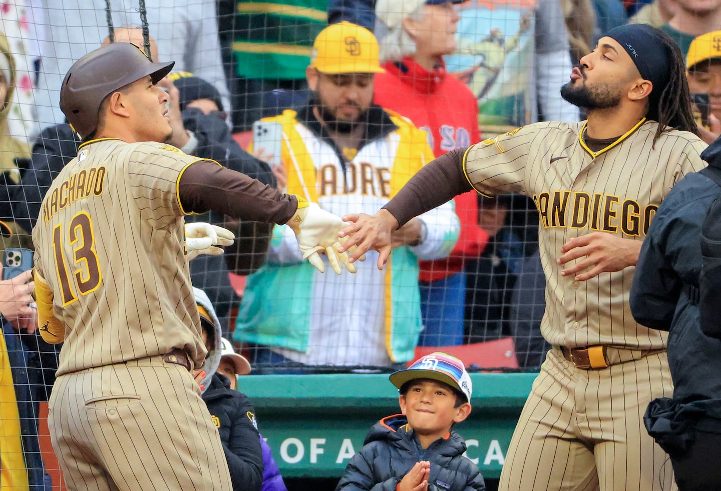 Manny Machado (left) celebrates his three-run home run with Fernando Tatis in the fifth inning.