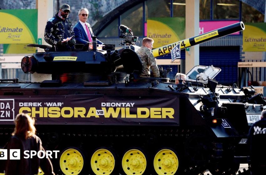  Chisora vs Wilder: Chisora arrives at news conference in a tank with Nigel Farage