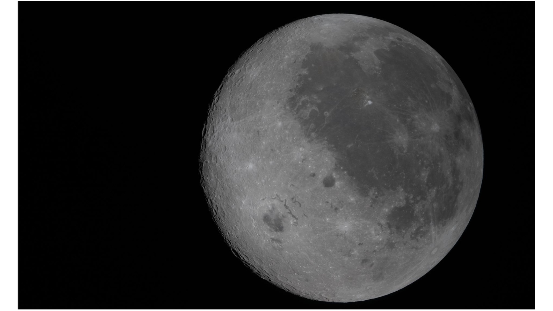 In this fully illuminated view of the moon, taken by the Artemis 2 mission during its lunar flyby on April 6, 2026, the near side (the hemisphere we see from Earth), is visible on the right. It is identifiable by the dark splotches that cover its surface.