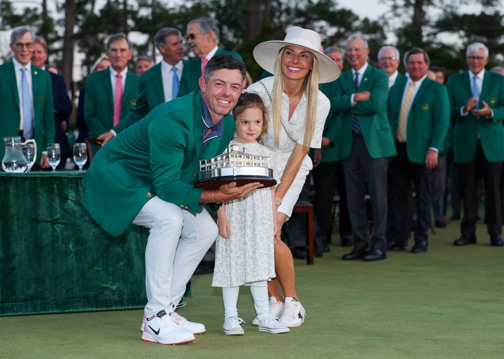 Rory McIlroy celebrates his Masters win last year with wife Erica Stoll and daughter Poppy.