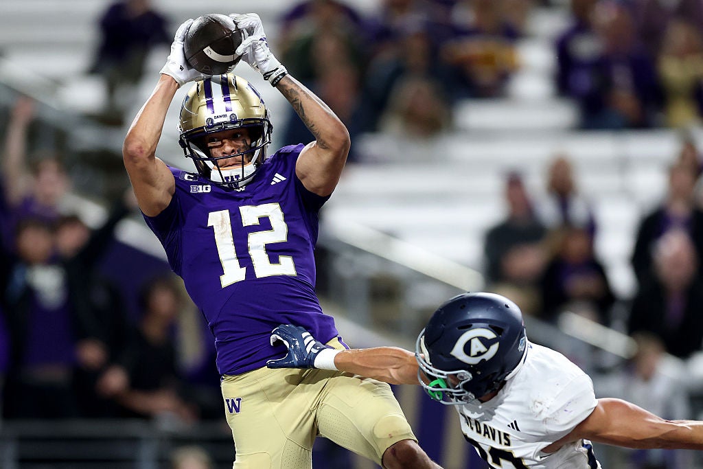 SEATTLE, WASHINGTON - SEPTEMBER 06: Denzel Boston #12 of the Washington Huskies catches a pass but lands out of bounds against the UC Davis Aggies during the second half at Husky Stadium on September 06, 2025 in Seattle, Washington. (Photo by Steph Chambers/Getty Images)