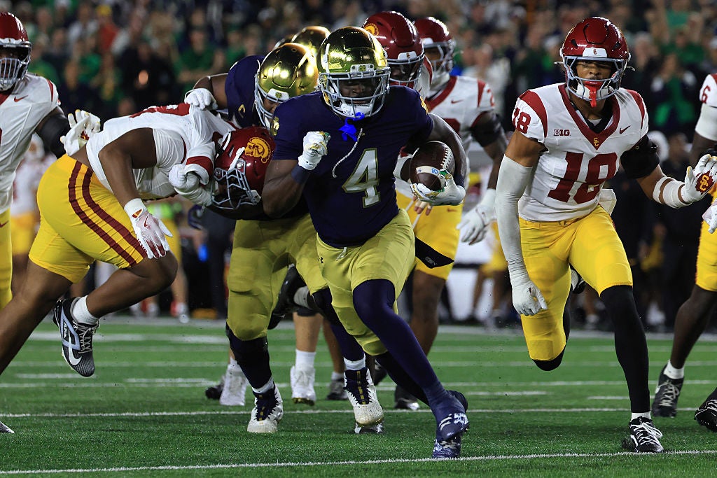 SOUTH BEND, INDIANA - OCTOBER 18: Jeremiyah Love #4 of the Notre Dame Fighting Irish runs for a touchdown in the first quarter against the USC Trojans at Notre Dame Stadium on October 18, 2025 in South Bend, Indiana.