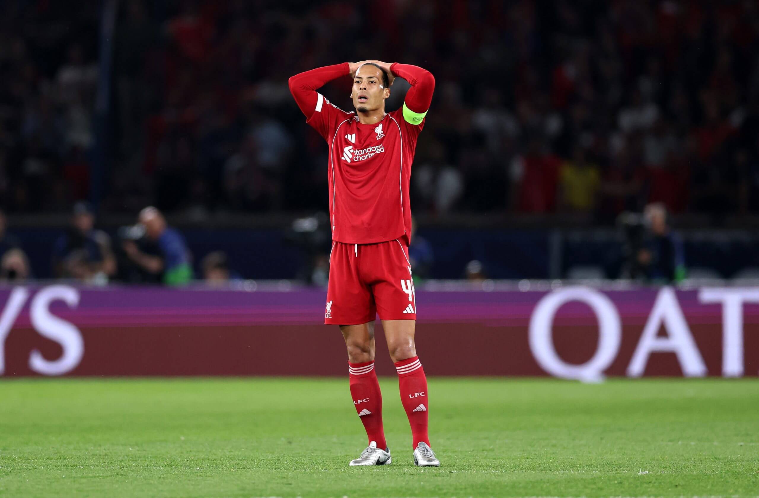 Liverpool's Virgin van Dijk is pictured with his head in his hands