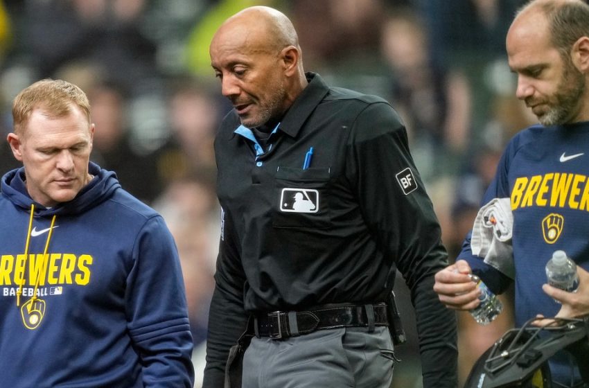  MLB umpire C.B. Bucknor leaves the game after taking foul ball to the face