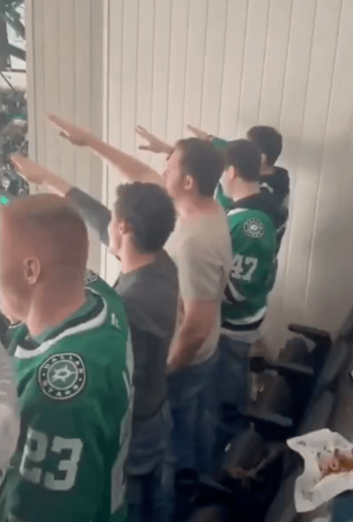 People in jerseys doing Nazi salutes.