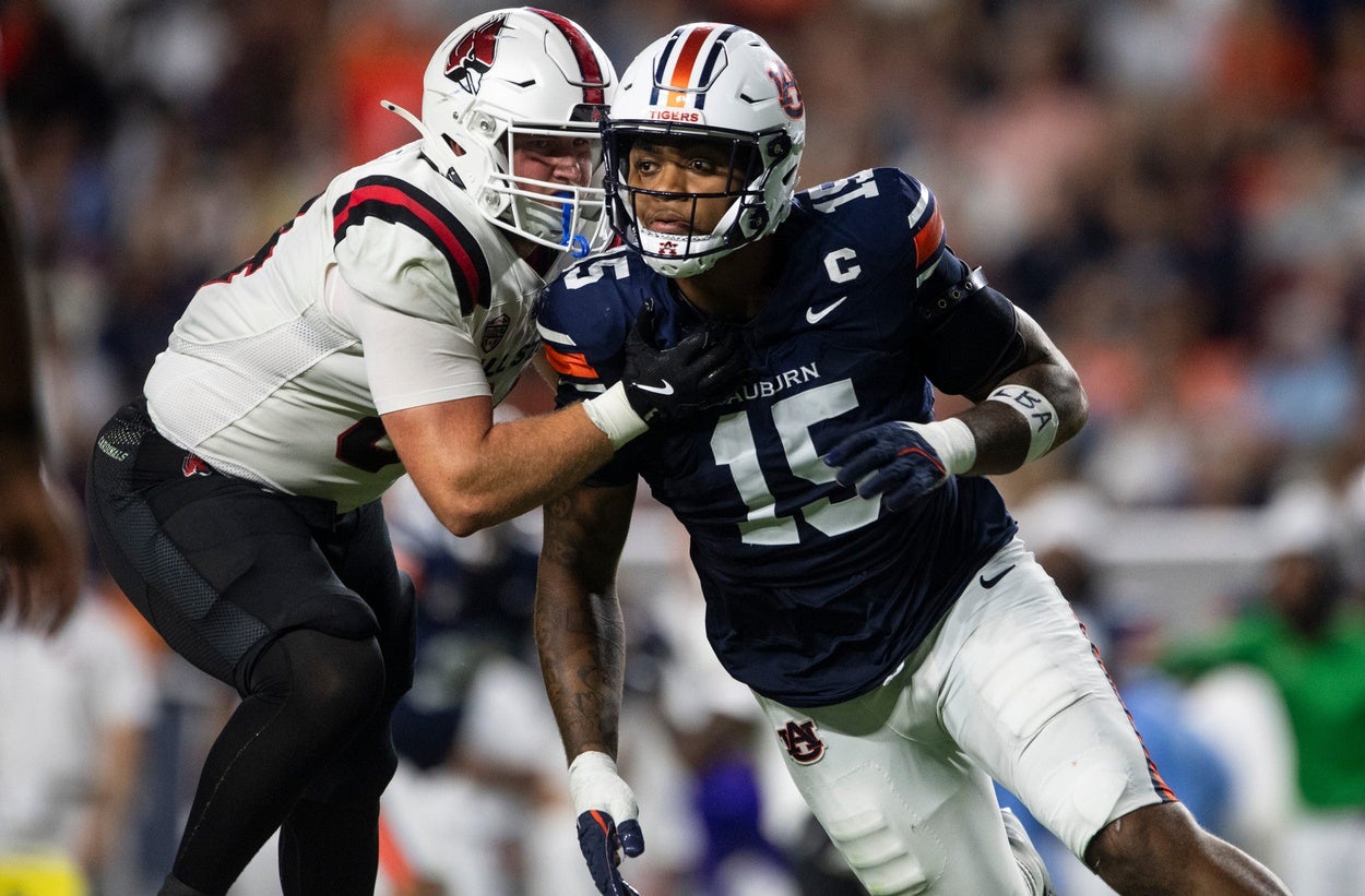 Auburn Tigers defensive end Keldric Faulk (15) blitzes as Auburn Tigers take on Ball State Cardinals at Jordan-Hare Stadium in Auburn, Ala. on Saturday, Sept. 6, 2025. Auburn Tigers defeated Ball State Cardinals 42-3.