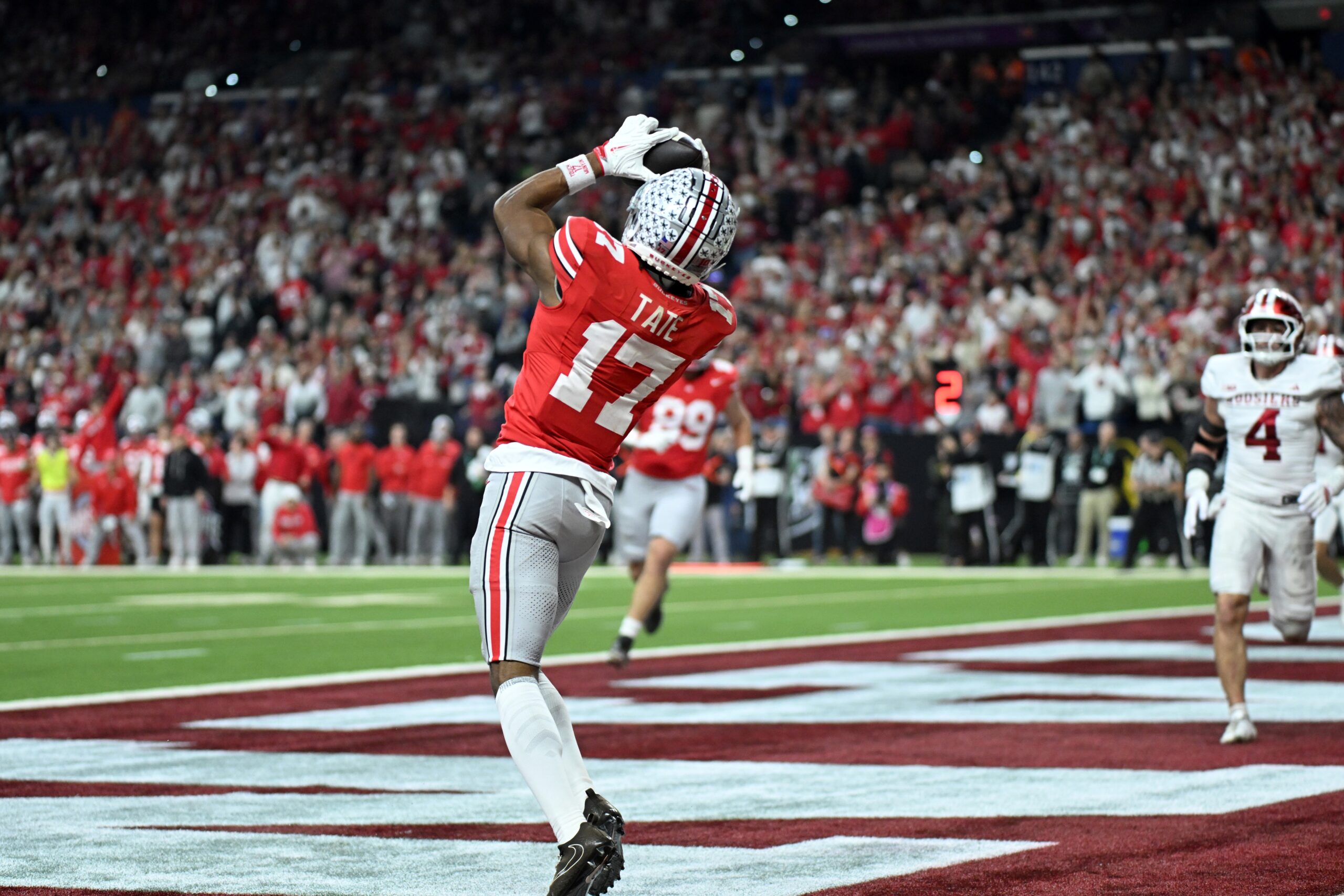 Dec 6, 2025; Indianapolis, IN, USA; Ohio State Buckeyes wide receiver Carnell Tate (17) scores a touchdown against the Indiana Hoosiers in the first quarter during the 2025 Big Ten championship game at Lucas Oil Stadium. Mandatory Credit: Robert Goddin-Imagn Images