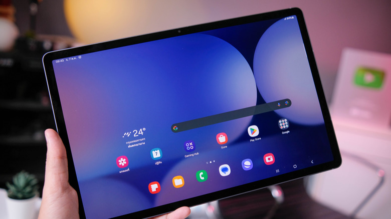 Person holding a Samsung Galaxy Tab S10+