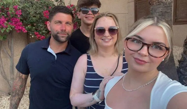 Grant Learmont with his wife and childrenCredit: SWS