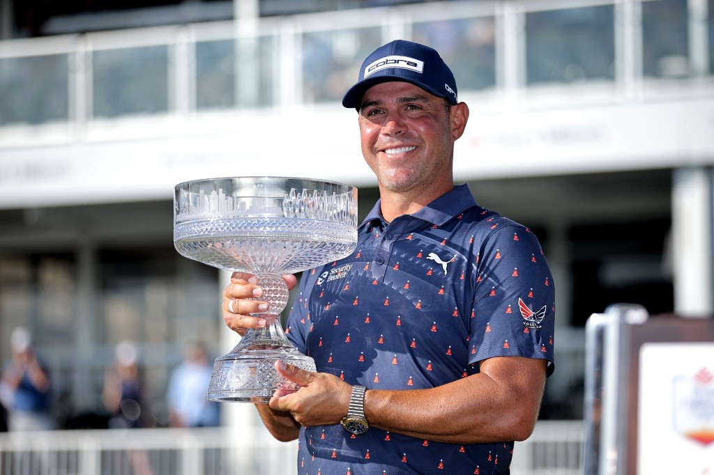 Gary Woodland holding the championship trophy after winning the Texas Children's Houston Open.