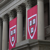 Harvard banners hang in front of Widener Library during the 374th Harvard Commencement in Harvard Yard in Cambridge, Massachusetts.