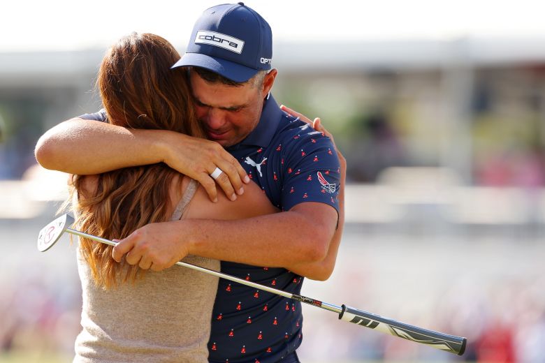Woodland embraces his wife, Gabby, after his Houston Open win.