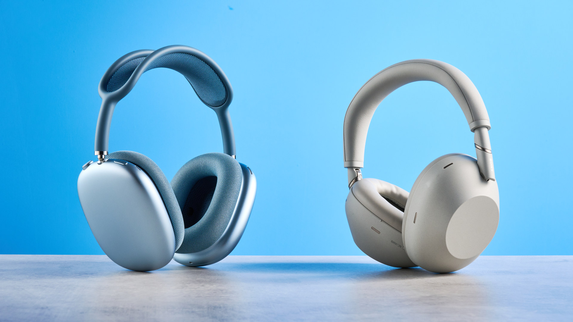 the sony wh-1000xm6 headphones in beige photographed against the blue tom's guide background
